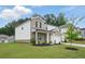 Charming two-story home with a brick and white facade, a well-manicured lawn, and an attached two-car garage at 4477 Bethany Manor Dr, Snellville, GA 30039