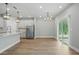 Bright kitchen with stainless steel appliances, white cabinets, an island, and an open floorplan at 4477 Bethany Manor Dr, Snellville, GA 30039