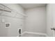 Practical laundry room with shelving for optimal organization and storage at 4477 Bethany Manor Dr, Snellville, GA 30039