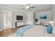 Spacious bedroom with a sitting area and a view into the bathroom at 4477 Bethany Manor Dr, Snellville, GA 30039