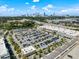 Aerial view of a retail area with a busy parking lot and the city skyline in the background at 970 N Ormewood Park Se Dr, Atlanta, GA 30316