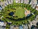 An aerial view of a neighborhood park with walking trails and a playground area at 970 N Ormewood Park Se Dr, Atlanta, GA 30316