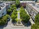 Aerial view of a neighborhood with walking paths, green spaces, and nearby shops at 970 N Ormewood Park Se Dr, Atlanta, GA 30316