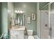 Well-lit bathroom with vanity, shower, and classic fixtures, designed for comfort at 970 N Ormewood Park Se Dr, Atlanta, GA 30316