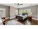 Sunlit bedroom with hardwood floors, large windows, and plush bedding, offering a relaxing retreat at 970 N Ormewood Park Se Dr, Atlanta, GA 30316