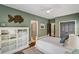 Bedroom with white furniture, ceiling fan, and gray trim at 970 N Ormewood Park Se Dr, Atlanta, GA 30316