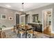 Elegant dining room with hardwood floors, stylish lighting, and ample space for entertaining at 970 N Ormewood Park Se Dr, Atlanta, GA 30316