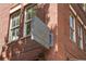 A close exterior detail showing a gray 'Drip Coffee' sign attached to the red brick of the building at 970 N Ormewood Park Se Dr, Atlanta, GA 30316