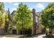 Exterior home elevation surrounded by trees and landscaping at 970 N Ormewood Park Se Dr, Atlanta, GA 30316