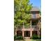 Charming brick townhome with a covered porch and manicured landscaping at 970 N Ormewood Park Se Dr, Atlanta, GA 30316