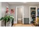 Hallway area with view of bathroom, storage shelves, and view to other room at 970 N Ormewood Park Se Dr, Atlanta, GA 30316