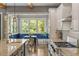 Bright kitchen with stainless steel appliances, granite counters, kitchen island and natural light at 970 N Ormewood Park Se Dr, Atlanta, GA 30316