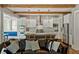Open concept kitchen with stainless steel appliances, white cabinets, and a large center island at 970 N Ormewood Park Se Dr, Atlanta, GA 30316