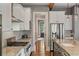 Kitchen with stainless steel appliances, white cabinets and granite countertops at 970 N Ormewood Park Se Dr, Atlanta, GA 30316