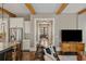 Open concept living room showcasing hardwood floors and access to the front entrance and kitchen at 970 N Ormewood Park Se Dr, Atlanta, GA 30316