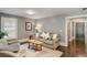 Bright living room with neutral decor, hardwood floors, and natural light from the window at 970 N Ormewood Park Se Dr, Atlanta, GA 30316