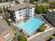 Aerial view of the community pool with lounge chairs and nearby apartments at 970 N Ormewood Park Se Dr, Atlanta, GA 30316