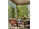 Cozy front porch featuring comfortable wicker seating and tranquil views of the surrounding greenery at 970 N Ormewood Park Se Dr, Atlanta, GA 30316