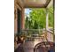 Inviting porch with wooden furniture and serene outdoor views, perfect for relaxing at 970 N Ormewood Park Se Dr, Atlanta, GA 30316