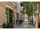 Exterior street view featuring a storefront with outdoor seating under the shade of beautiful trees at 970 N Ormewood Park Se Dr, Atlanta, GA 30316