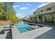 Backyard view of a pool and patio, outdoor bar, and the home's exterior at 126 Owens Mill Pl, Canton, GA 30115