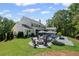 Scenic backyard with a pool, fire pit, and outdoor seating area at 126 Owens Mill Pl, Canton, GA 30115