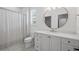 Light and airy bathroom with white vanity, round mirror, and shower with curtain at 126 Owens Mill Pl, Canton, GA 30115
