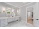 Bright bathroom with double vanity, marble floors, modern fixtures and plenty of storage space at 126 Owens Mill Pl, Canton, GA 30115