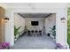Stylish entertainment room with a large TV, bar seating, and access to the outdoors at 126 Owens Mill Pl, Canton, GA 30115
