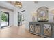 Bright foyer featuring hardwood floors, a decorative mirror and elegant lighting fixture at 126 Owens Mill Pl, Canton, GA 30115