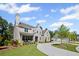 Elegant stone home with a welcoming front porch and beautiful landscaping at 126 Owens Mill Pl, Canton, GA 30115