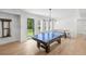Bright game room features a ping pong table, natural light, and view of outdoor space at 126 Owens Mill Pl, Canton, GA 30115