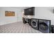 Well-appointed laundry room with a desk, modern washer/dryer, and ample storage space at 126 Owens Mill Pl, Canton, GA 30115