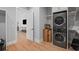 Convenient laundry room featuring stacked washer and dryer, storage, and easy access to closet at 126 Owens Mill Pl, Canton, GA 30115