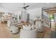 Open-concept living room connects to the modern kitchen and features hardwood floors, comfortable seating, and plenty of natural light at 126 Owens Mill Pl, Canton, GA 30115