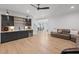 Open-concept living room with a wet bar, modern cabinets, and a comfortable sofa at 126 Owens Mill Pl, Canton, GA 30115