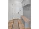Neutral mudroom with built-in storage, bench seating, and coat hooks, offering an organized entryway at 126 Owens Mill Pl, Canton, GA 30115