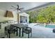 Outdoor living space featuring a patio with dining, grill, and bar area, with a pool in the background at 126 Owens Mill Pl, Canton, GA 30115