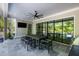 Outdoor patio featuring a black dining set, ceiling fan, and large sliding glass doors to the yard at 126 Owens Mill Pl, Canton, GA 30115