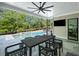 Backyard featuring an in-ground pool, patio, and an outdoor dining area with a black table and chairs at 126 Owens Mill Pl, Canton, GA 30115