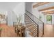 Elegant staircase with wooden steps, black metal railing, and open design at 126 Owens Mill Pl, Canton, GA 30115