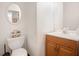Cozy bathroom with a toilet, a mirror, and a wooden vanity at 2770 Nautical Way, Villa Rica, GA 30180