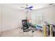 Neutral carpeted bedroom with ceiling fan and natural light from the window at 2770 Nautical Way, Villa Rica, GA 30180