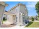 Tan two-story home with a covered patio, green grass and white trim at 2770 Nautical Way, Villa Rica, GA 30180