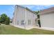 View of a two-story home featuring a manicured lawn and neutral siding at 2770 Nautical Way, Villa Rica, GA 30180