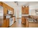 Traditional kitchen with wood cabinets, stainless appliances, and tile backsplash at 2770 Nautical Way, Villa Rica, GA 30180