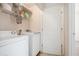 Laundry room featuring a washer, dryer, and wire shelving at 2770 Nautical Way, Villa Rica, GA 30180