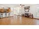 Open concept living room and kitchen with tile flooring, fireplace, and bar seating at 2770 Nautical Way, Villa Rica, GA 30180