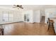 Spacious living room features tile flooring, ceiling fan, and access to the backyard through french doors at 2770 Nautical Way, Villa Rica, GA 30180