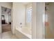 Bathroom with a tub and a glass enclosed shower at 2770 Nautical Way, Villa Rica, GA 30180